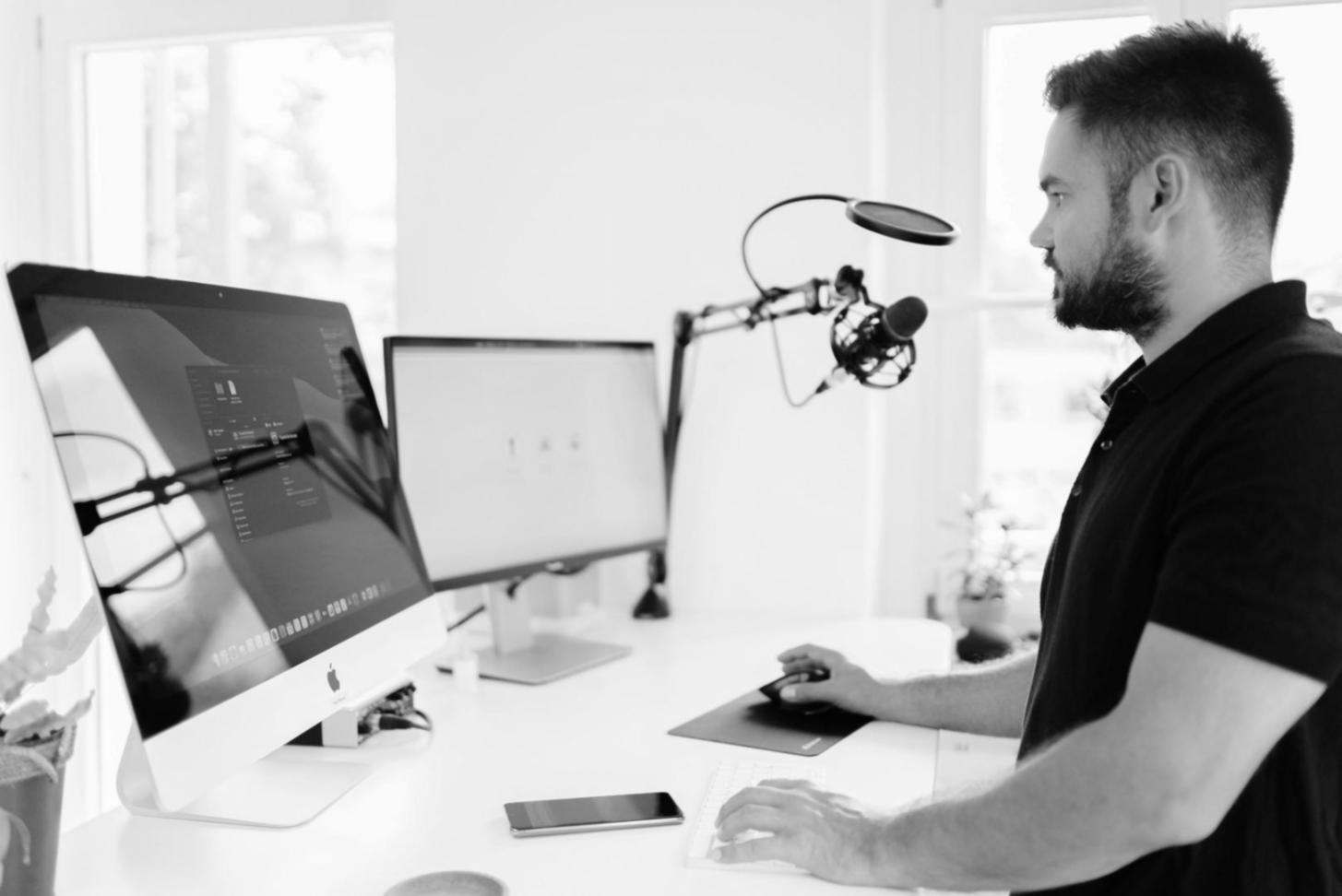 Clean workspace with organised financial documents and laptop showing analysis software